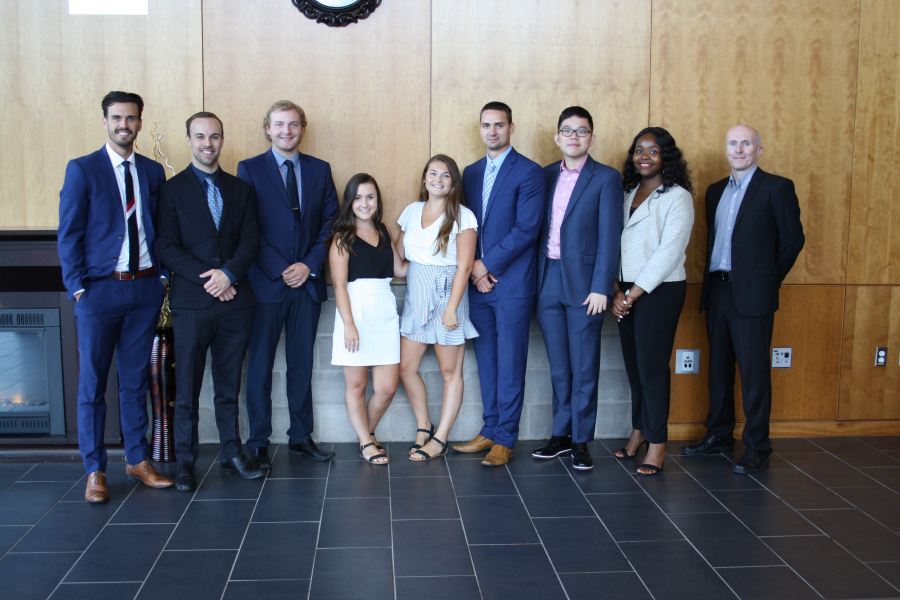 A group of graduate students standing in a row