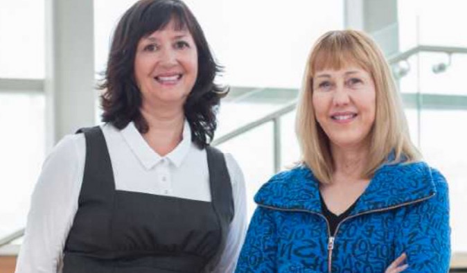 photo of two women standing side by side