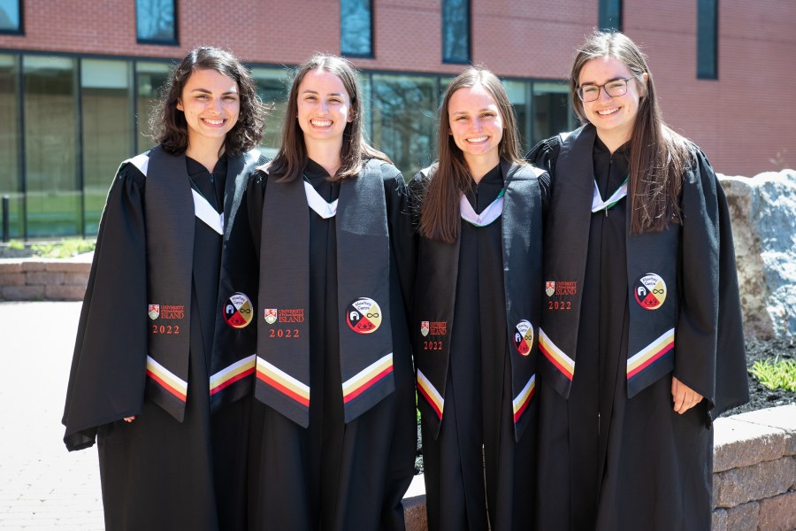 Graduates and sisters Julia, Tiffany, Megan, and Madison Grounds