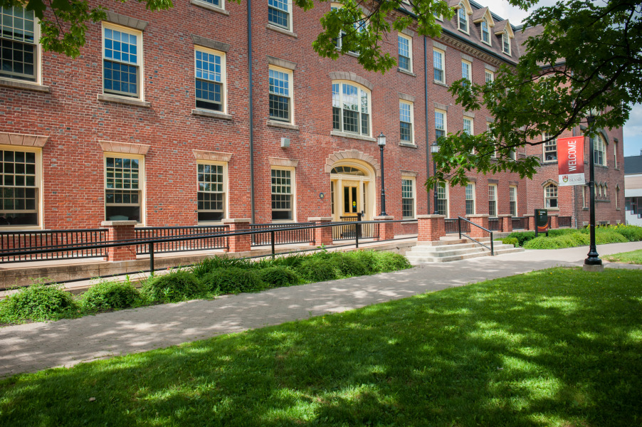 Photo of SDU Main building with welcome banner in foreground