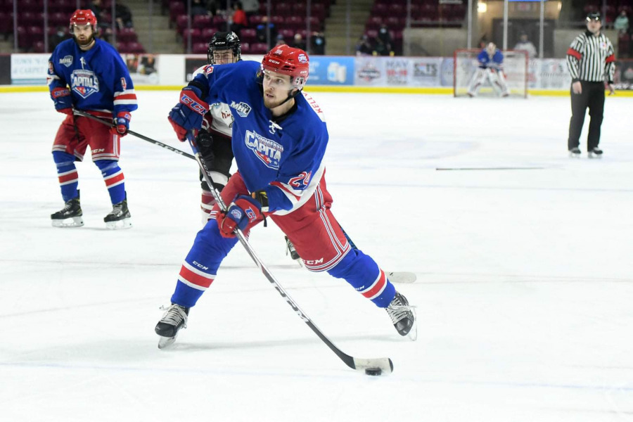 photo of hockey player shooting the puck