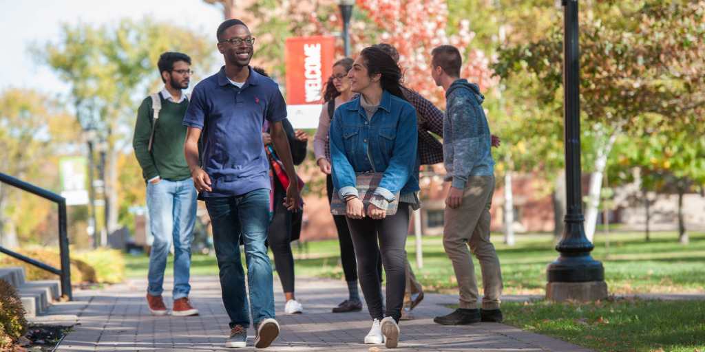 Students walking outdoors on the UPEI campus