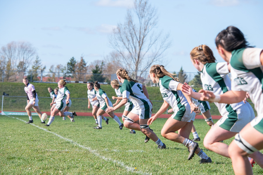 The UPEI Women's Rugby Panthers line up for a kickoff against the St. Francis Xavier X-Women during the 2022 AUS semifinals.