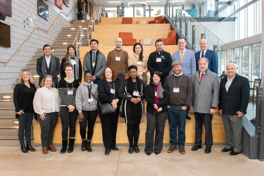 Emerging Leaders in the Americas Program delegates and UPEI representatives on the academic staircase in the UPEI Faculty of Sustainable Design Engineering building.