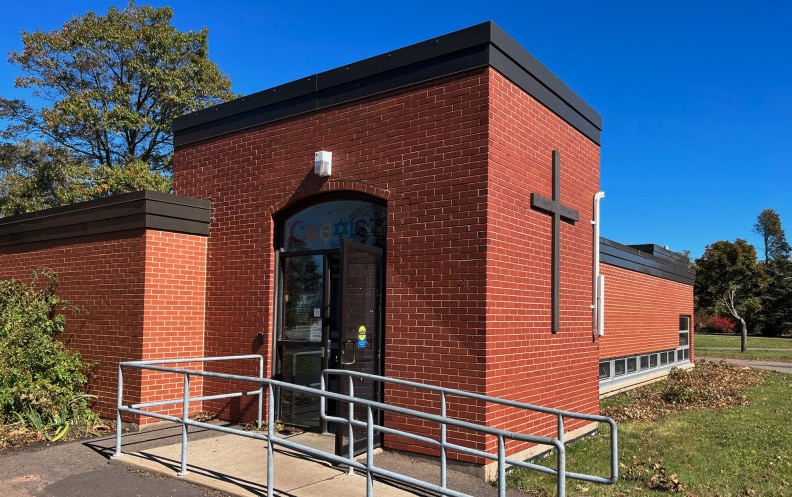 photo of the entrance to a brick building on campus