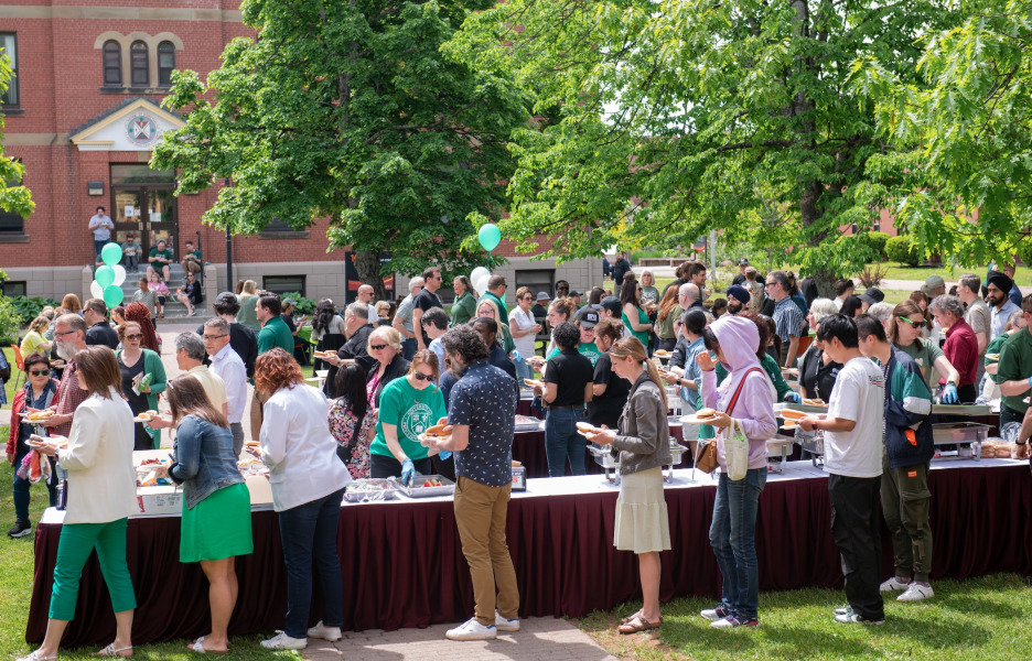 photo of a large group of people at a barbecue