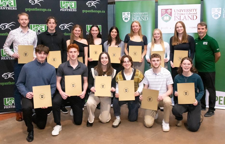 Head coach Lewis Page joins members of the UPEI Women’s and Men’s Soccer teams after they receive their U SPORTS Academic All-Canadian certificates.