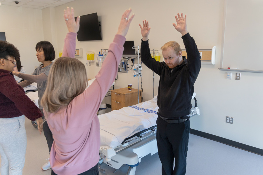 Graduating nurse practitioner students Laura Smith and Calvin Murray