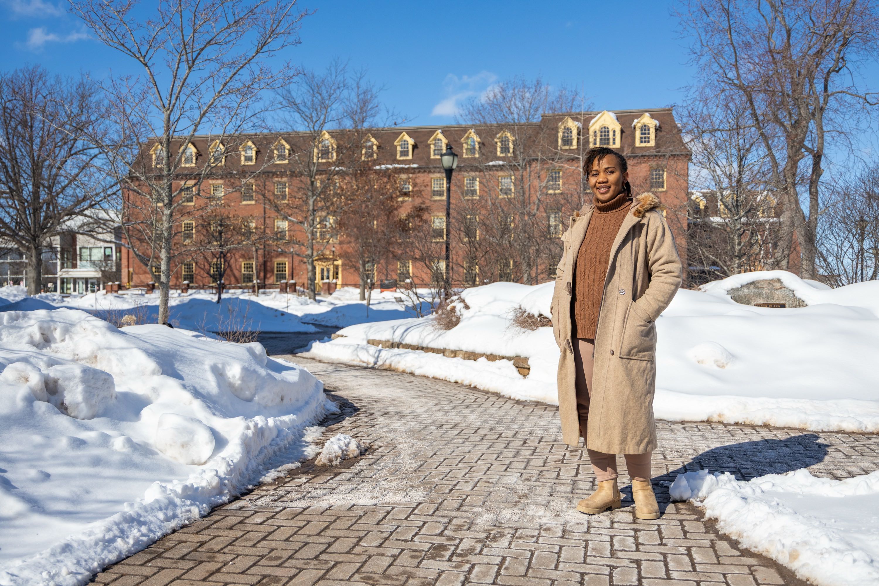 UPEI graduate Patience Adaobor standing in the quad in winter