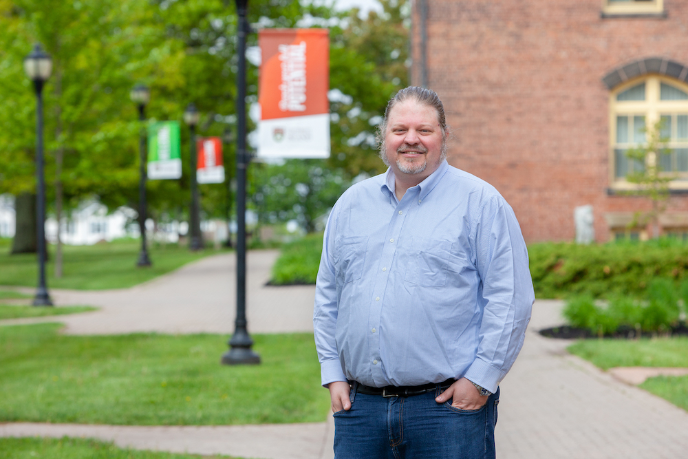 Dr. Mike MacLellan standing in the UPEI quad