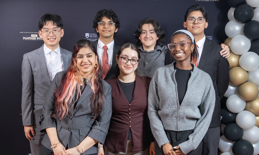 a group of seven students at an entrepreneurship event
