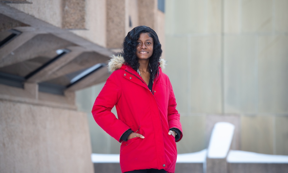 a female student in a red coat 