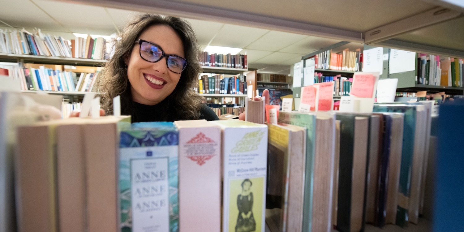 dr. kate scarth in the stacks at upei's robertson library