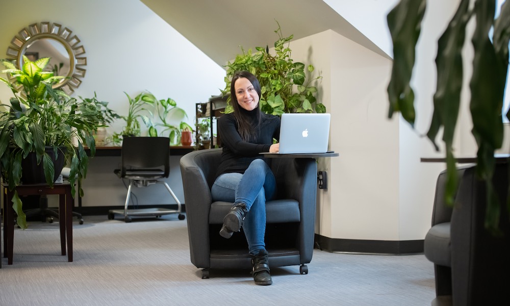 UPEI education graduate Nicole in a Main Building student lounge