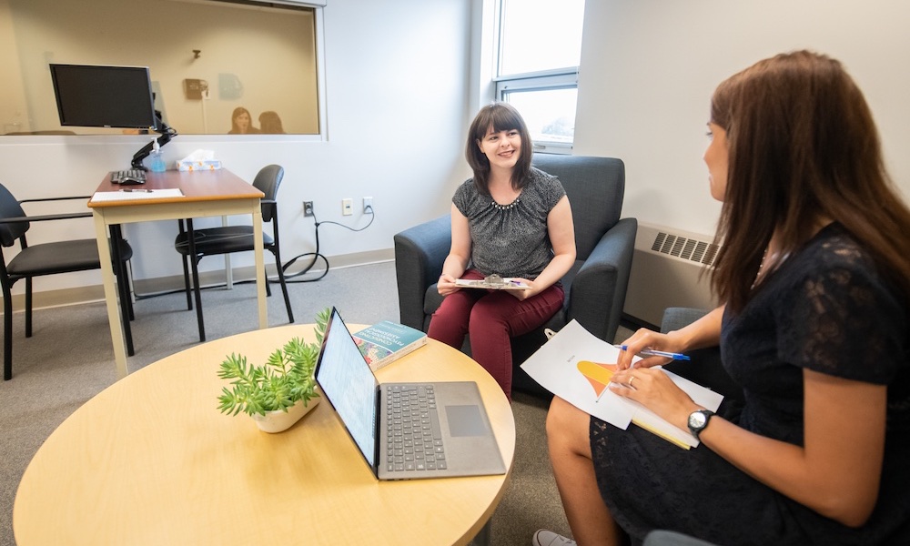 two doctor of psychology program students in a clinical setting