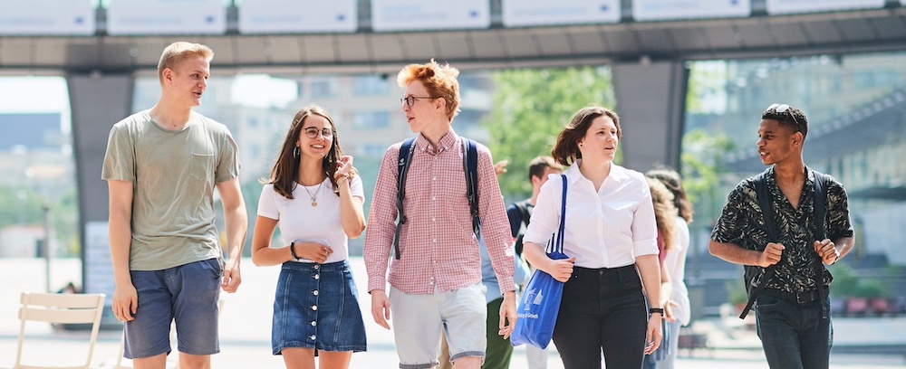 students walking by a bridge in Brussels