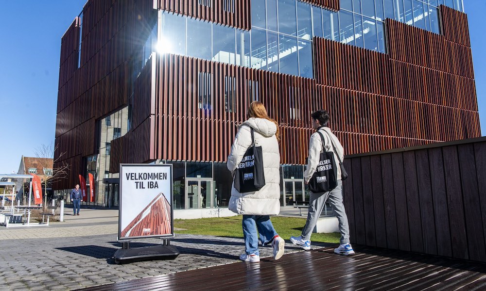 two students walking outside the International Business Academy