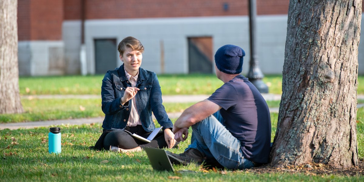 two people talking in the UPEI quad