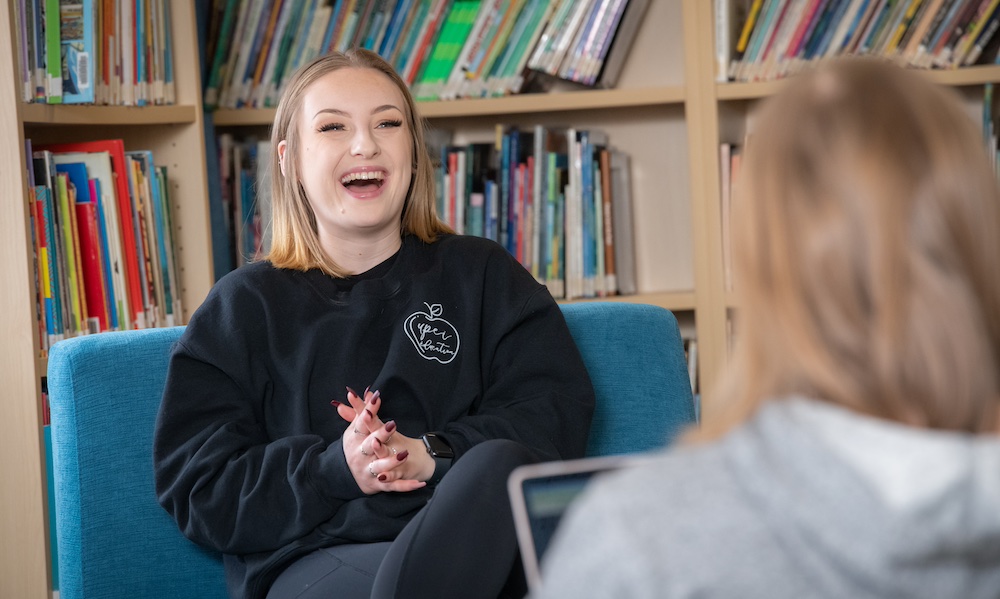 a UPEI education student laughing with a colleague