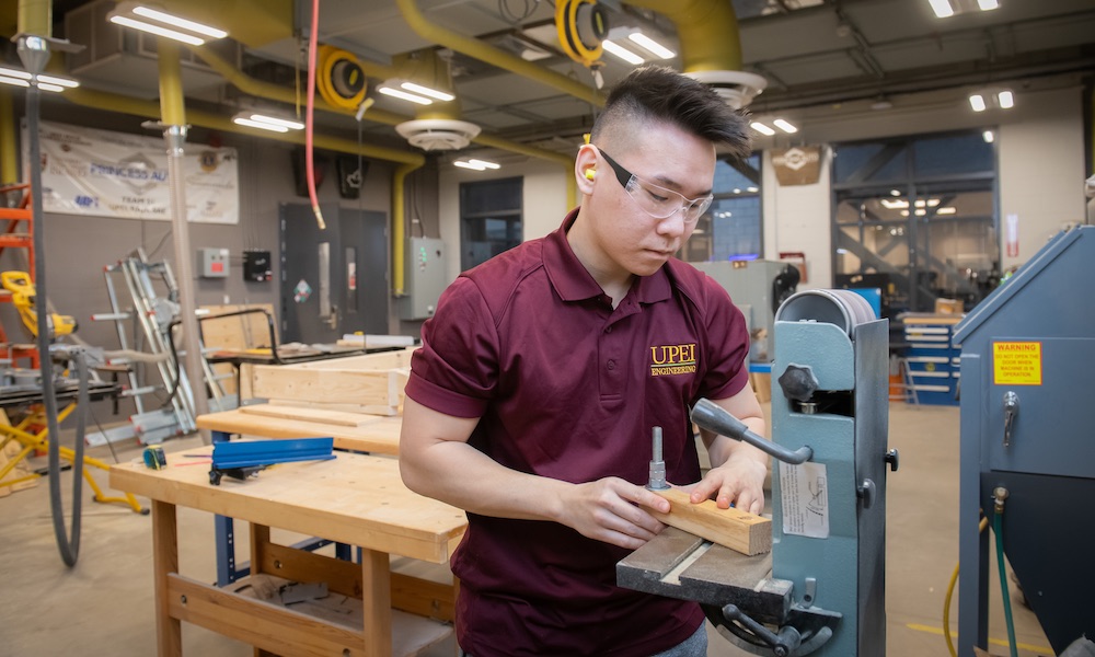 UPEI engineering student Yvan in the Faculty of Sustainable Design Engineering building lab