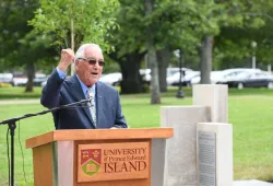 A man stands at a podium 