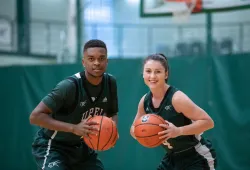 A male and a female basketball player