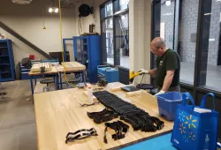 Engineering technologist Chuck Terrio works on bands for protective face shields being produced by the UPEI Faculty of Sustainable Engineering.