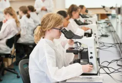 Students in the 2019 AVC Vet Camp learn how to use a microscope.