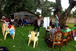 Farmers in Kenya participate in a training session.  Standing at right is Dr. John VanLeeuwen.