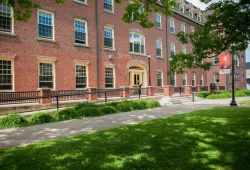 An image of a brick, three story building on UPEI Campus. It's SDU Main Building