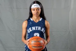 photo of a female student-athlete holding a basketball