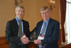 Dr. John VanLeeuwen presents Dr. Gary Conboy with the 2021 Atlantic Award of Excellence in Veterinary Medicine and Animal Care. 