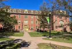 Photo of SDU Main Building on a sunny day with blue sky