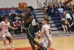 UPEI Men’s Basketball Panther Elijah Miller attempts a pass in a November 5 game against the Acadia Axemen.