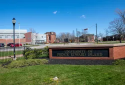 photo of sign in front of UPEI campus with student centre in background