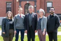  Dr. Philip Smith (centre), professor of psychology and director of clinical training for the UPEI PsyD program, with students Tessa O'Donnell, Vincent Salabarria, Shauna Reddin, and Faraz Mirza