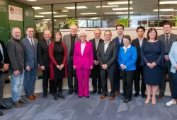 Photos of a large group of people standing in entrepreneurship centre