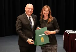 Dr. Greg Keefe, interim president and vice-chancellor presents Nicole Murphy, Faculty of Veterinary Medicine with a 25-year service award