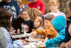 Child explores bones at the AVC Open House