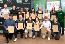 Head coach Lewis Page joins members of the UPEI Women’s and Men’s Soccer teams after they receive their U SPORTS Academic All-Canadian certificates.