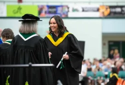 Photo of woman receiving her degree at Convocation