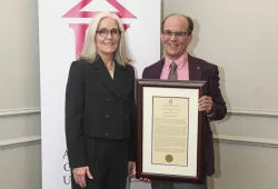 Dr. Wendy Rodgers (left), president and vice-chancellor of UPEI congratulates Dr. Andrew Zinck, a professor in the UPEI Department of Music, on winning the AAU’s 2025 Distinguished Teaching Award.
