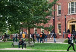 Photo of students walking in university quadrangle 