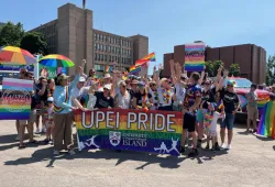 Photo of a group at the Pride Parade wearing colourful clothing