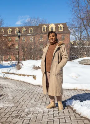 UPEI graduate Patience Adaobor standing in the quad in winter