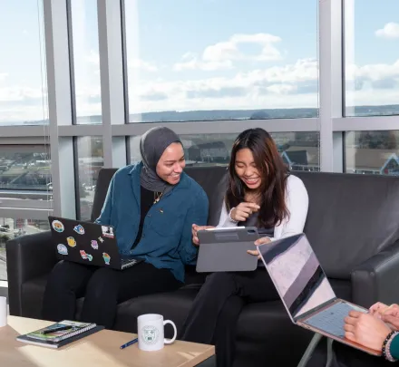 two students working in a UPEI residence lounge