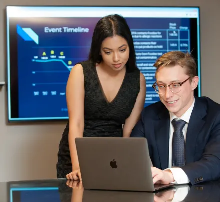 two UPEI Business students using a computer