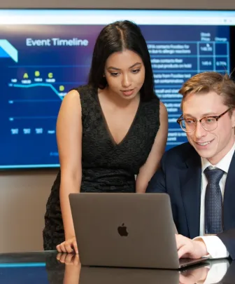 two UPEI Business students using a computer