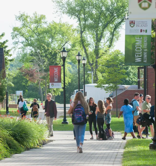 students in the quad in front of steel building 