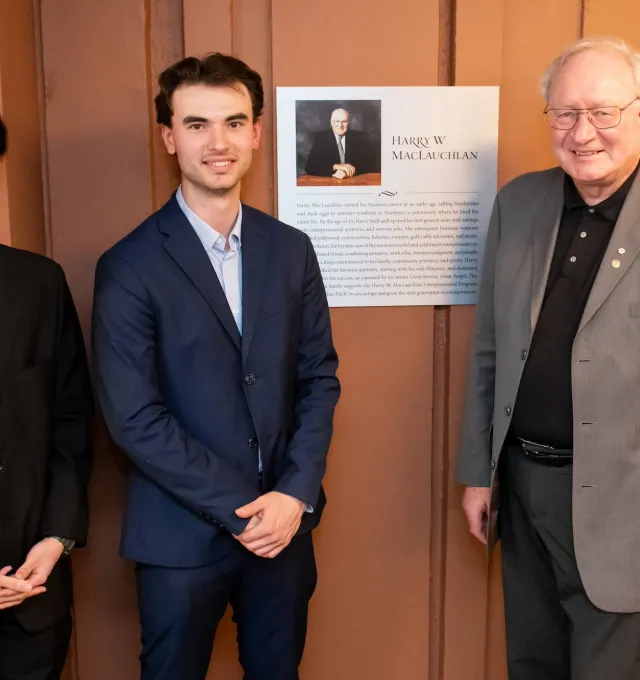 two students with Wade MacLauchlan